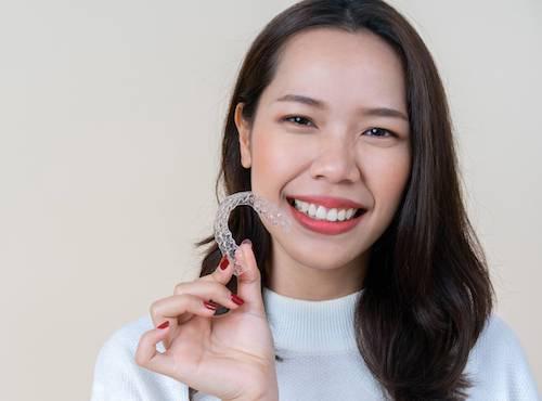 lihue women holding invisalign