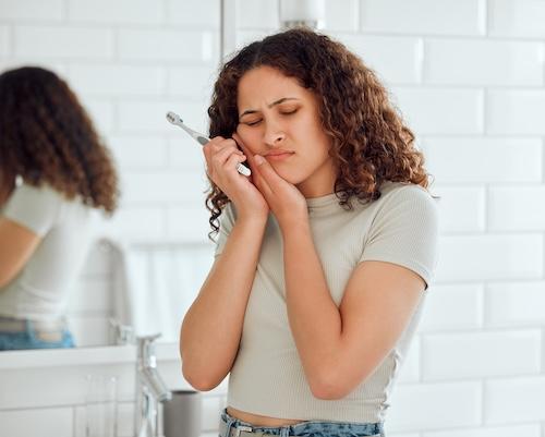 woman with a toothache from cavity