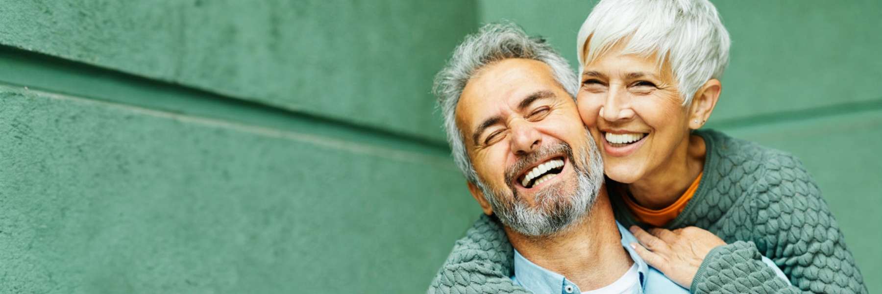 man and woman hugging